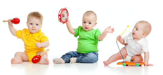 Children playing with musical toys. Isolated on white background © Oksana Kuzmina