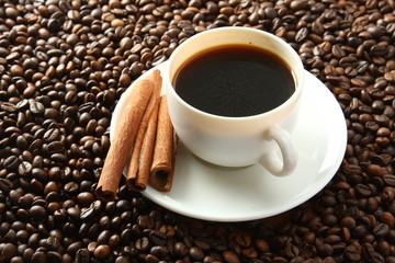 a cup of coffee and coffee beans