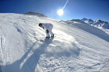 skiing on fresh snow at winter season at beautiful sunny day