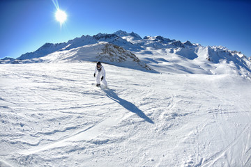 skiing on fresh snow at winter season at beautiful sunny day