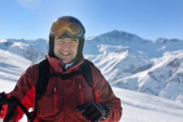 Fototapeta na wymiar skiing on fresh snow at winter season at beautiful sunny day
