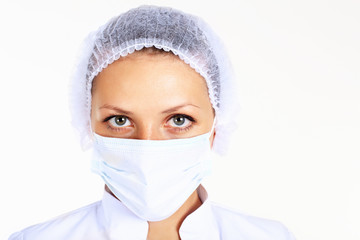 Young female scientist wearing face mask