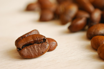 Coffee beans on wooden table
