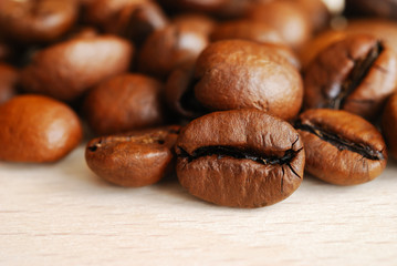 Closeup of coffee beans on a wooden table