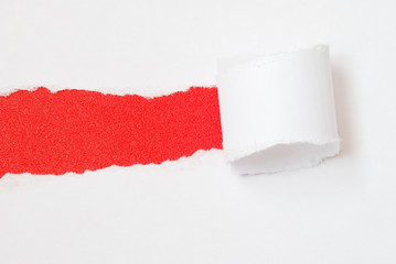 Ripped paper on red background