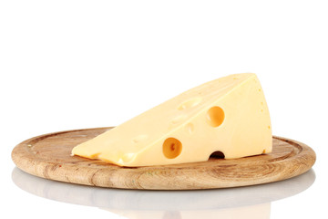 Сheese on wooden board isolated on white