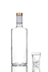 Bottle of vodka and wineglass isolated on white - obrazy, fototapety, plakaty