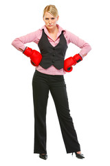 Full length portrait of business woman in boxing gloves