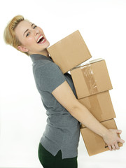Woman with many packets grooving as a parcel service