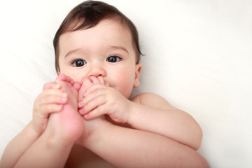 Baby sucking his toes