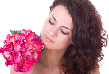 Fototapeta premium Beauty face of the young woman with flower