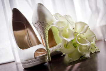 Bridal shoes and bouquet