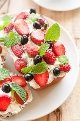 Lemon Pound Cake topped with whipped cream, fresh fruits