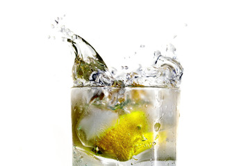 Drink with splashing lemon over white