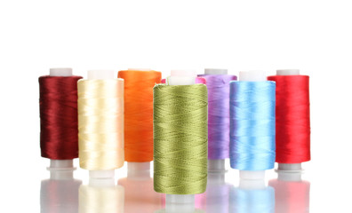 Many spools of thread isolated on white