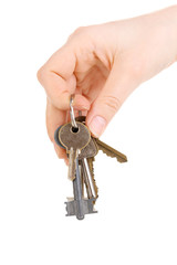 Bunch of keys in hand isolated on white
