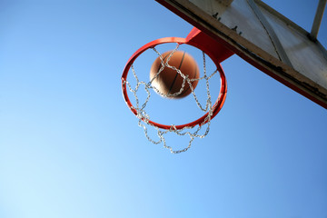 an image of playing basketball at the outside
