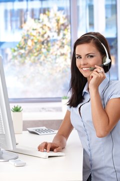 Young customer service operator working smiling
