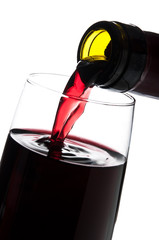pouring red wine isolated