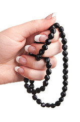 black beads in hand