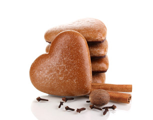 Heart-shaped cookies in stack with cinnamon, nutmeg and