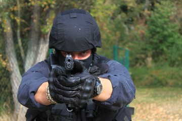 policeman pointing weapons at the camera, detail