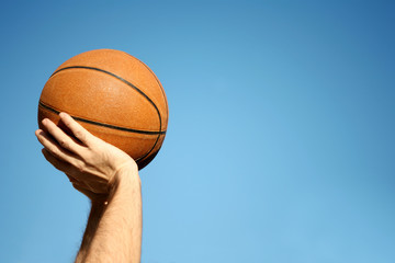 an image of playing basketball at the outside