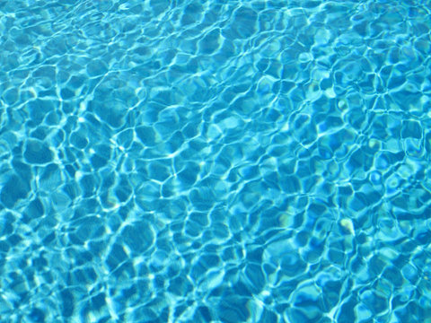 close up shot of blue textured water background