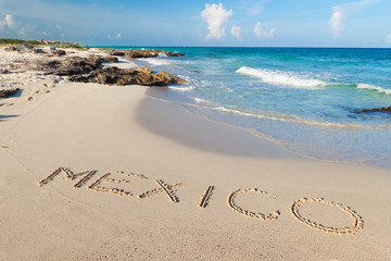 Mexico sign on the beach of Caribbean Sea