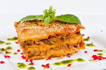 Closeup of lasagna and basil fork