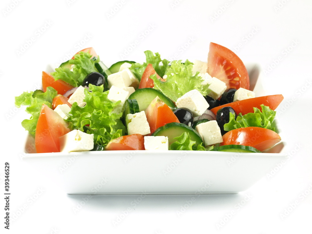 Wall mural Greek salad on isolated background