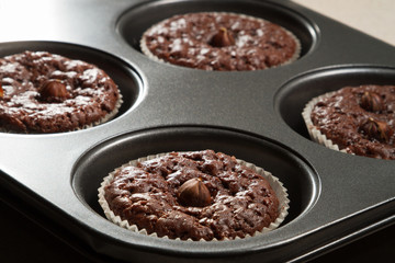 Chocolate muffin in baking tray