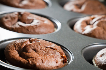 Closeup chocolate muffin in baking tray