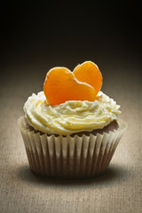 Chocolate muffin  with mandarin and cream