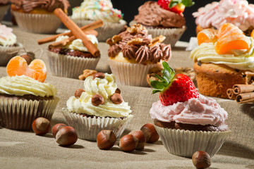 Various muffin with cream and fruits