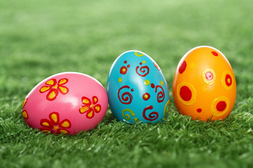Fototapeta na wymiar Colored eggs on lawn
