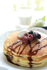 Western breakfast, berries on pan cake
