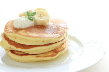 Pan cake and banana on white background