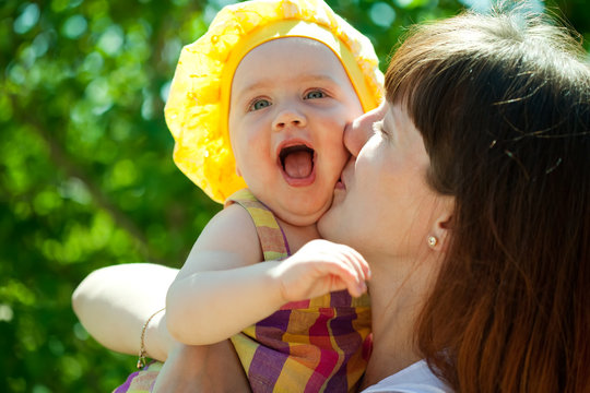 Happy Mother Kissing  Baby