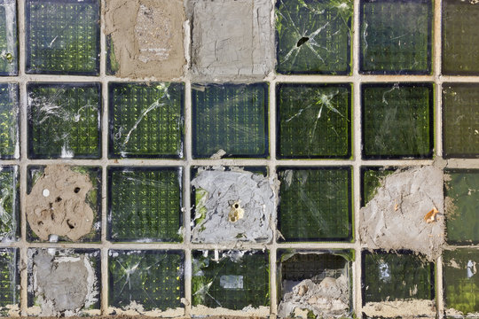 Broken green glass blocks background