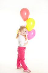 studio shot of pretty little girl with balloons