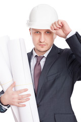 Engineer wearing white hardhat with blueprints isolated on white