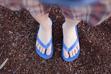 Boy wearing flip flops