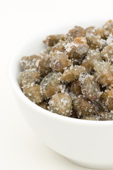 Salted capers of Pantelleria in a white bowl