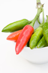 Red and green chilies in a bowl