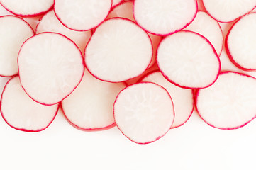 sliced red radish on white
