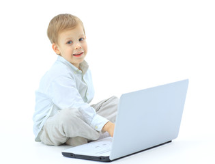 Cute child using laptop