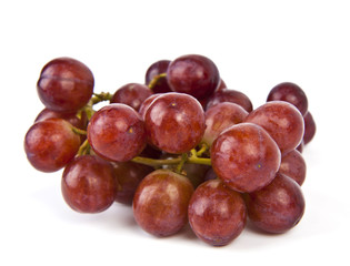 Red grapes on white background.