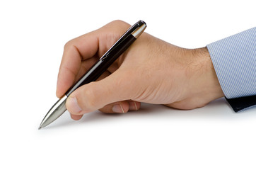 Hand with pen writing on white