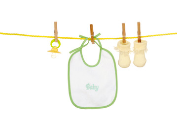 Isolated baby bib socks on a clothes line